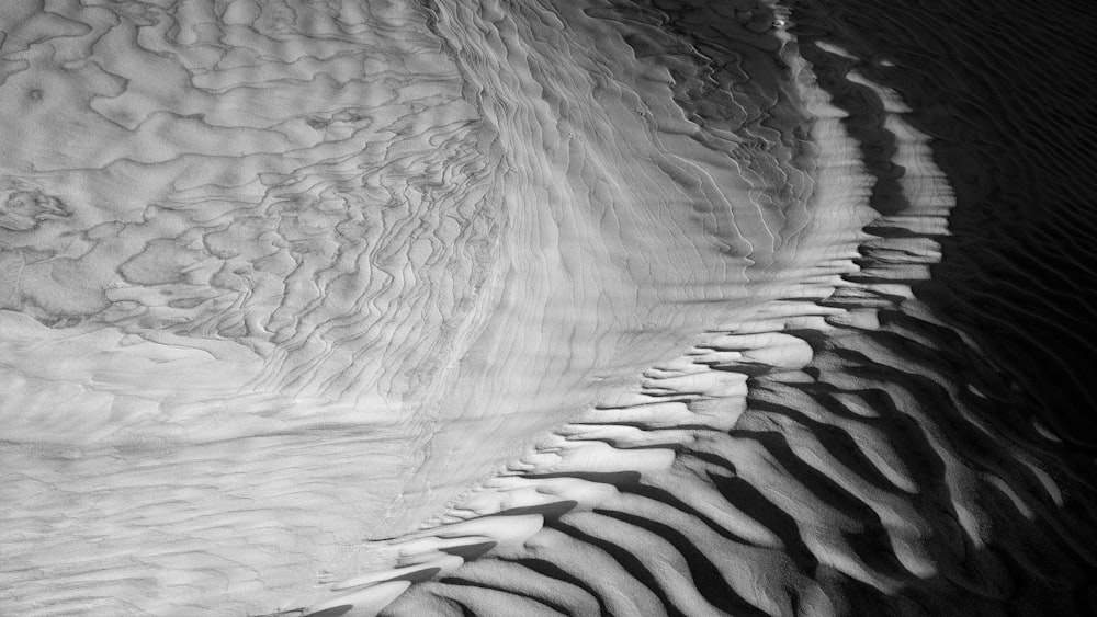 grayscale photo of water waves