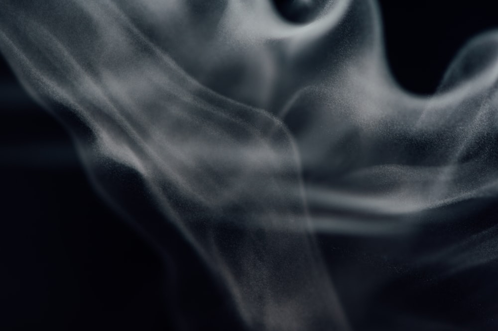 white smoke in a dark room