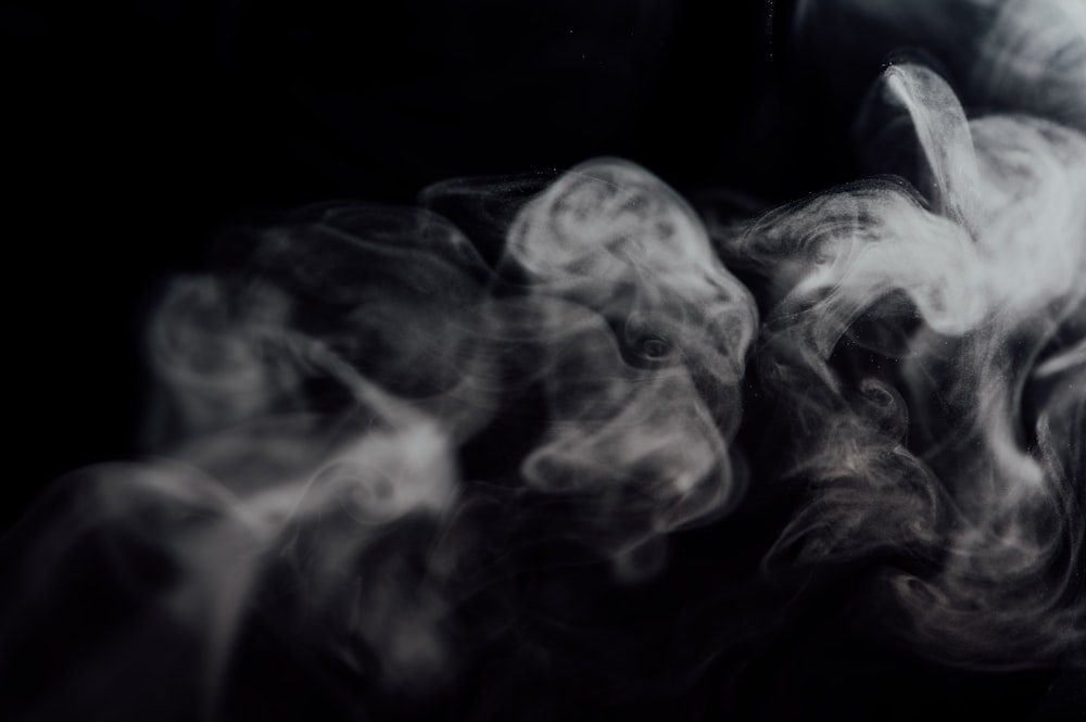 white smoke on black background