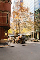 Concrete mixer truck leaving the Octogonal area after delivery, with city buildings in background.