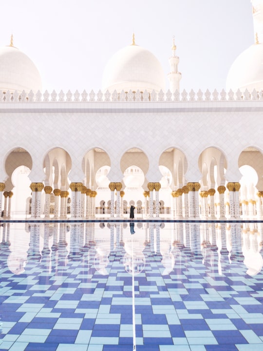 white concrete building during daytime in Sheikh Zayed Grand Mosque Center United Arab Emirates