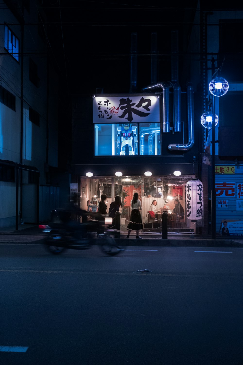 people walking on street during nighttime