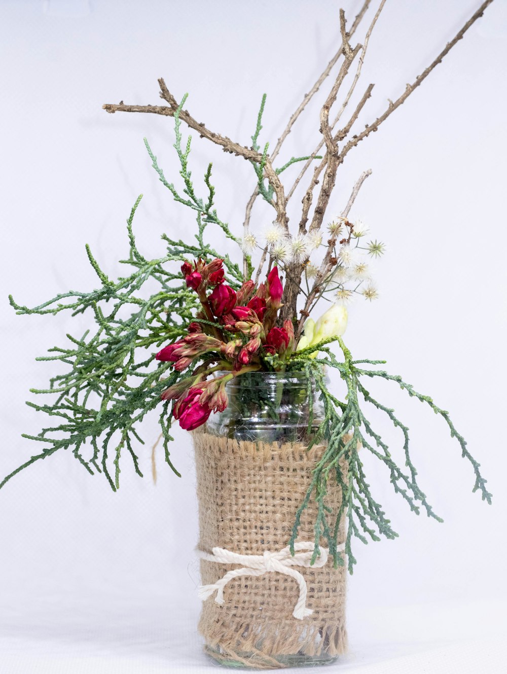 red and yellow roses in brown wicker basket