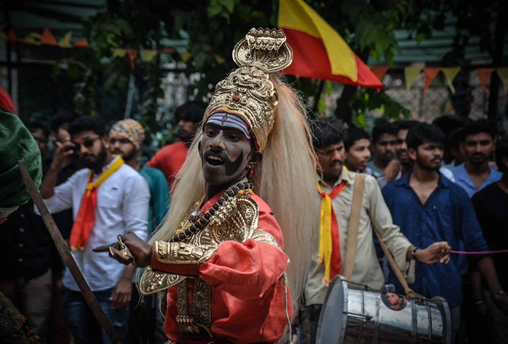 people in traditional dress standing on street during daytime