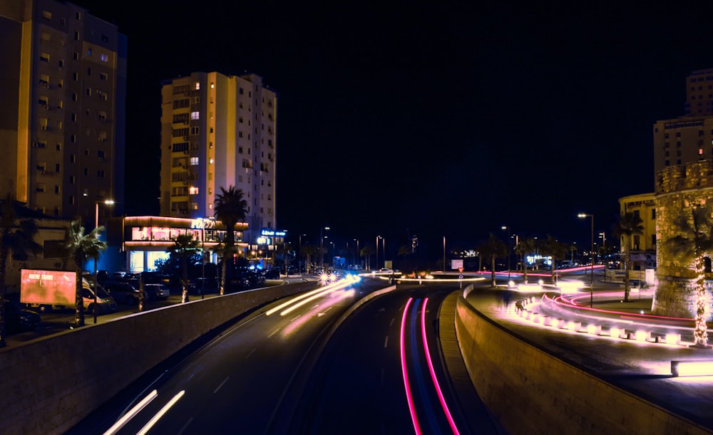 time lapse photography of cars on road during night time