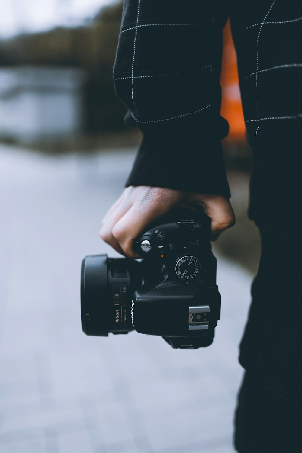 person holding black dslr camera