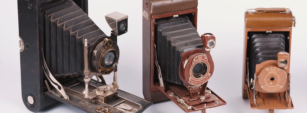 brown and black camera on white surface