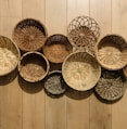 brown woven round baskets on brown wooden floor