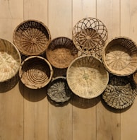 brown woven round baskets on brown wooden floor