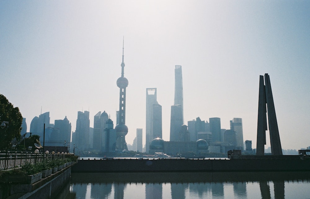 city skyline across body of water during daytime