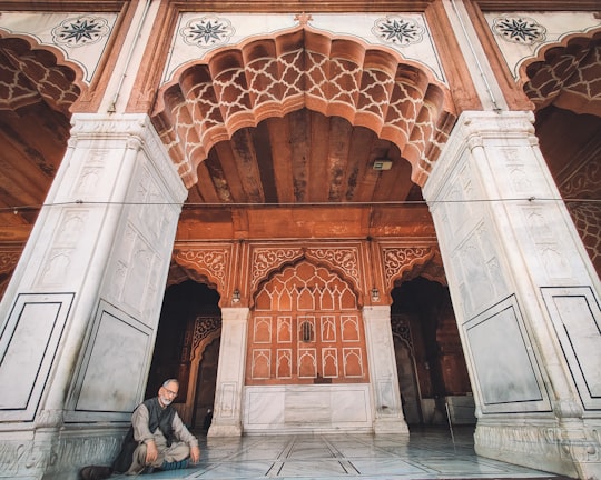 people walking on hallway during daytime in Jama Masjid India