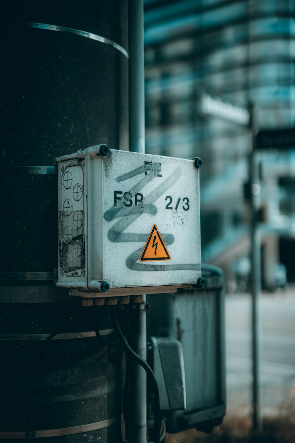 a sign on a pole on a city street