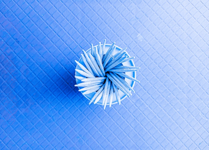 Top-down view of the pacific blue A3 cutting mat with precision grid lines visible