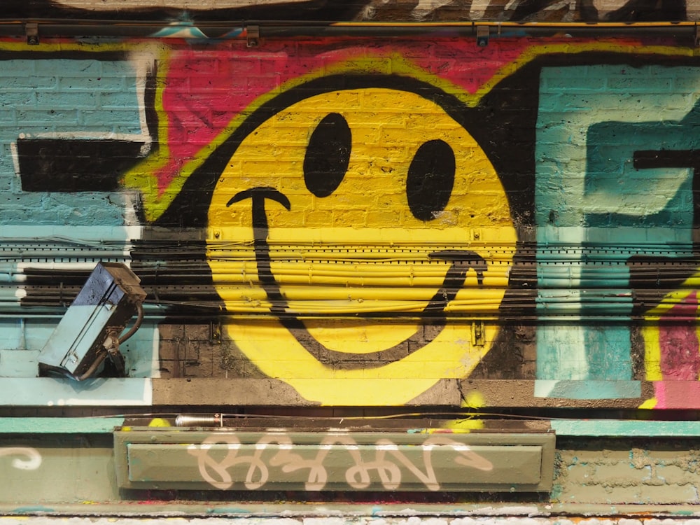 yellow and black smiley graffiti