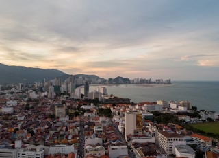 city skyline under white clouds during daytime