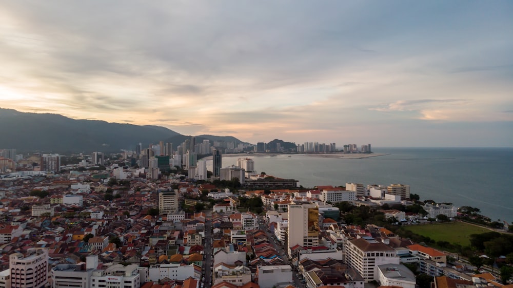 city skyline under white clouds during daytime