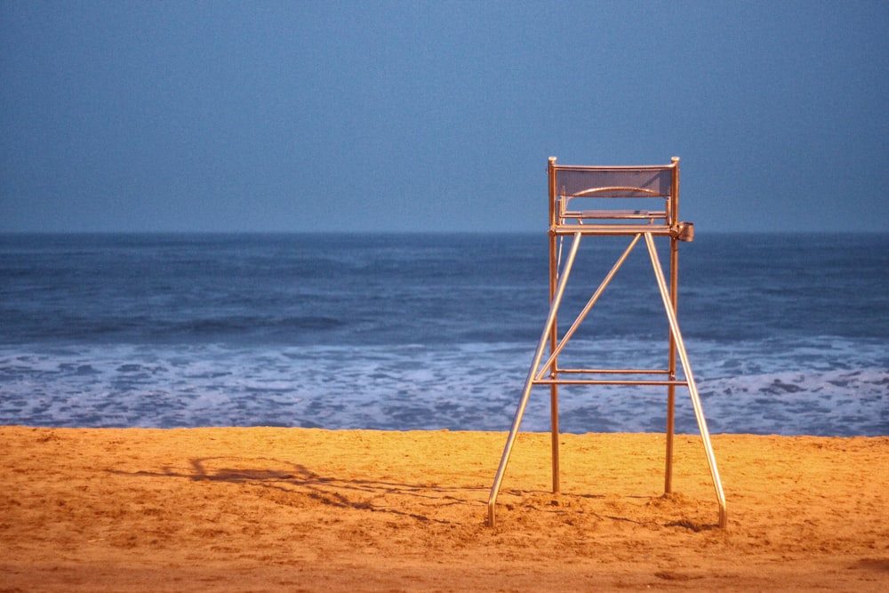 brown wooden ladder on seashore during daytime