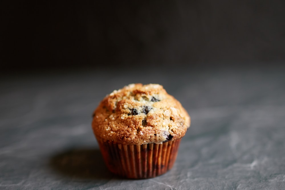 brown cupcake on brown wooden table