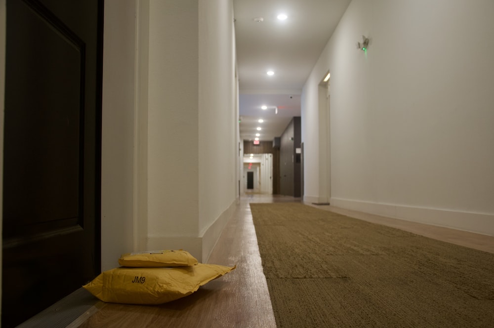 yellow plastic bag on brown carpet