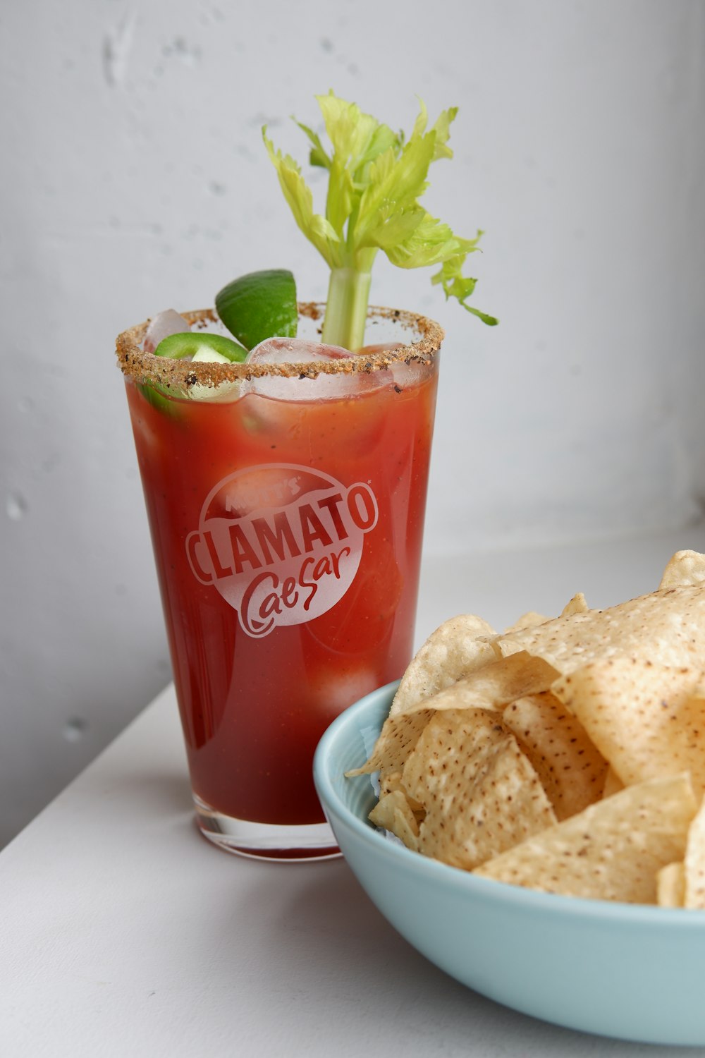 coca cola cup with green plant