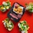 A package of plant-based nuggets is centered on a vibrant red background, surrounded by three taco-like servings filled with salad, avocado, and crispy nuggets. The package features bold text indicating the product is soya based and gluten-free.