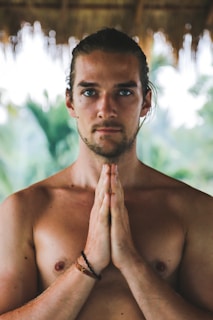 topless man with black hair