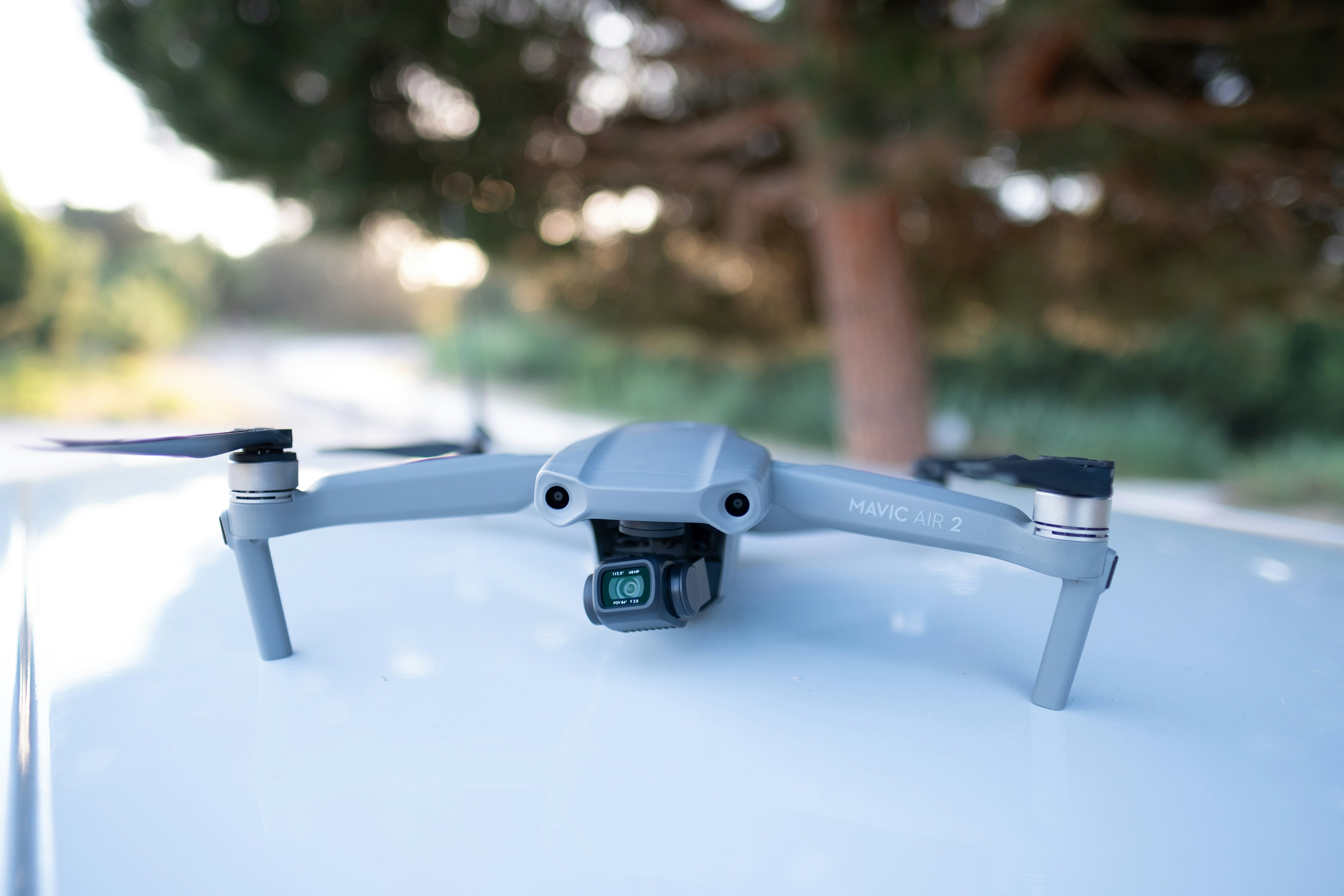 black and gray camera on white table