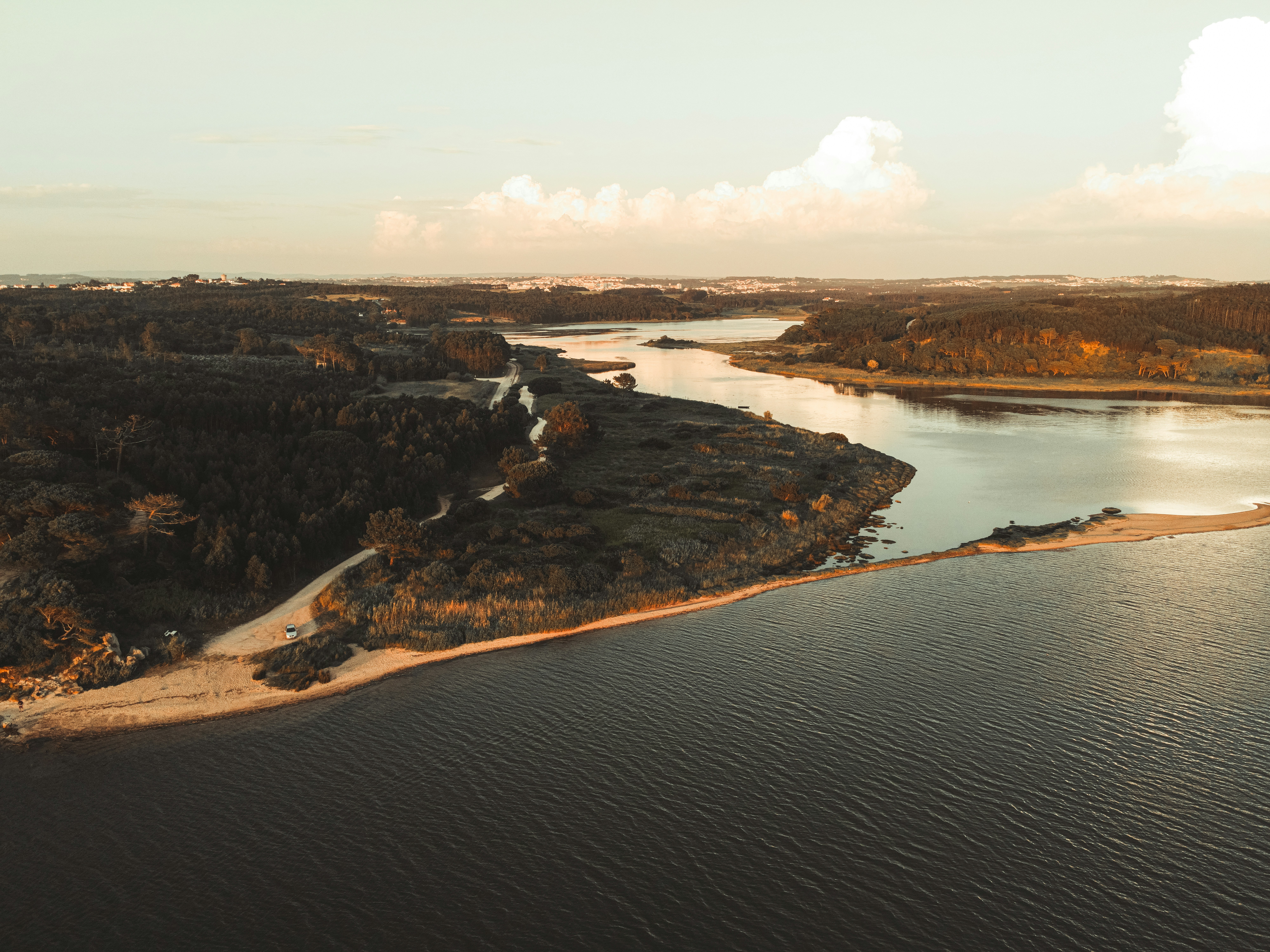 aerial view of lake and mountains during daytime