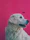 A vibrant digital portrait of a golden retriever displayed on a modern office wall.