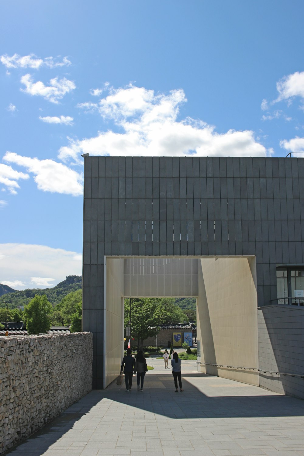 people walking near black concrete building during daytime