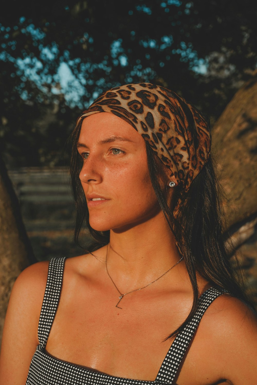 woman in black and brown leopard print tank top