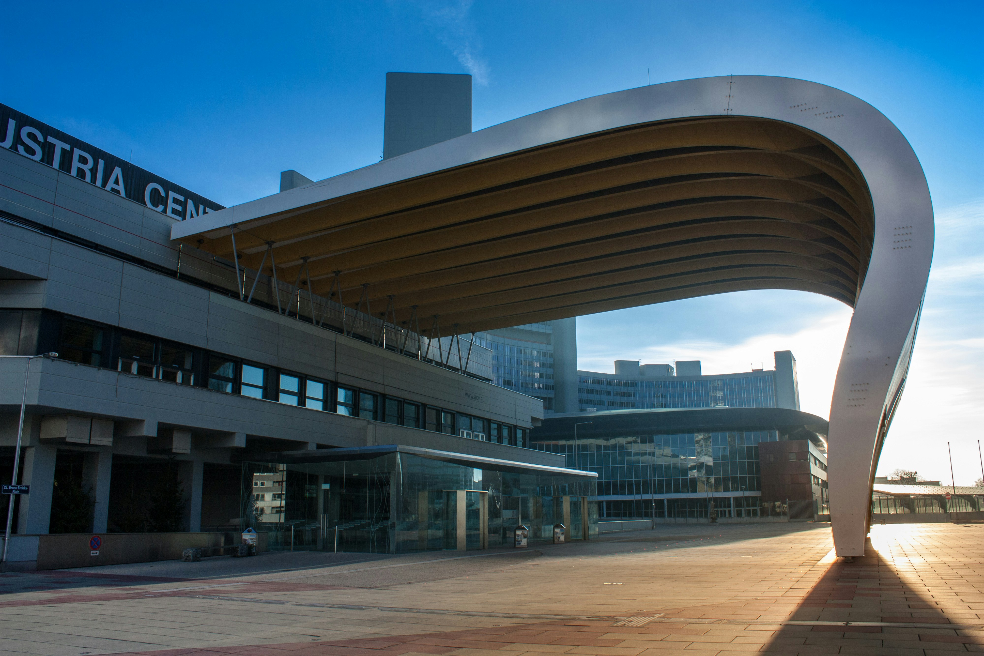 brown and white concrete building under blue sky during daytime