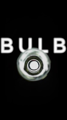 A bright bulb shining above a baseball glove, blending the brand's theme with its product.