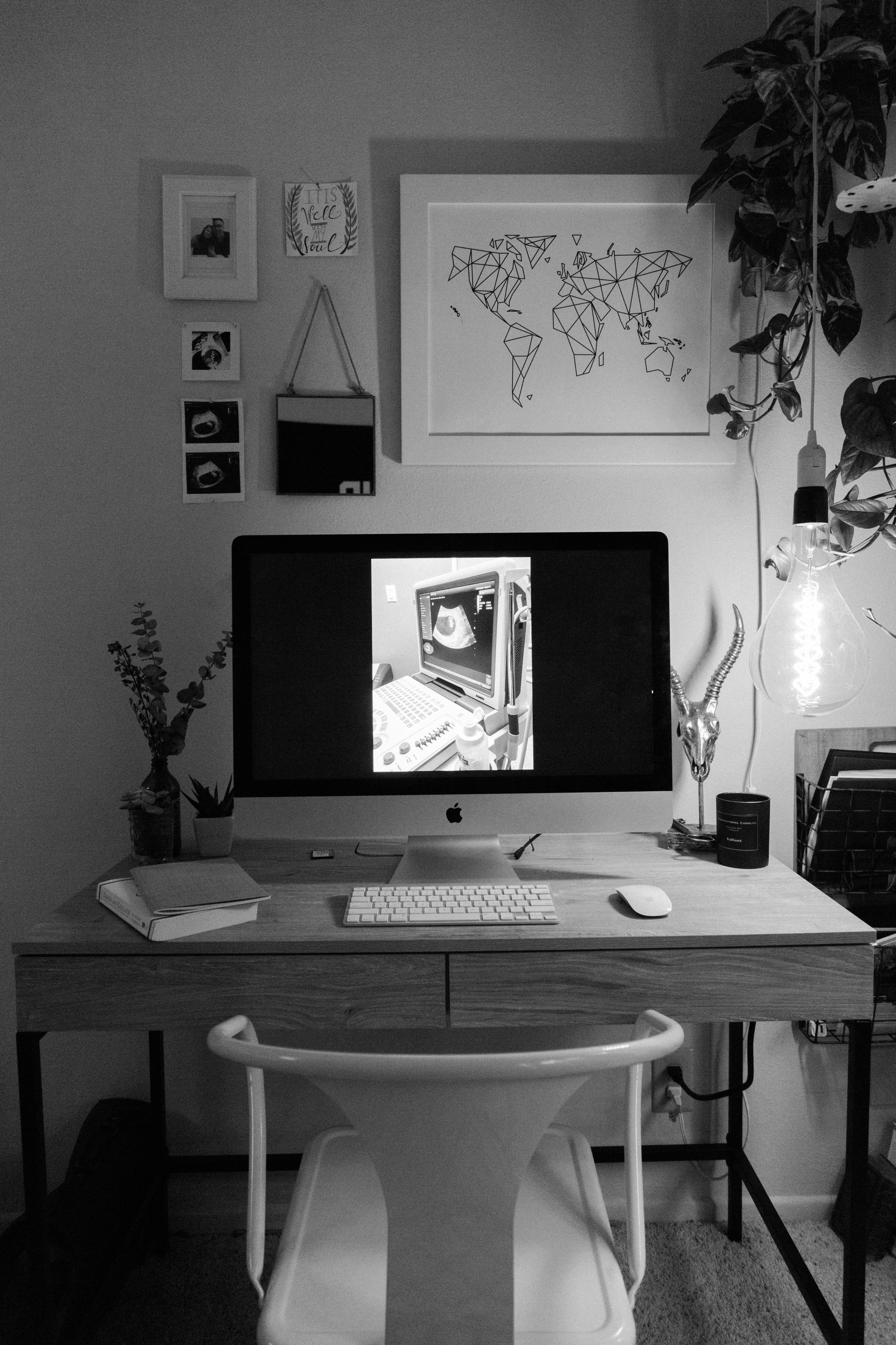 silver imac on brown wooden table