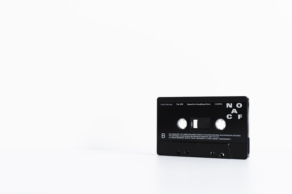 black cassette tape on white surface