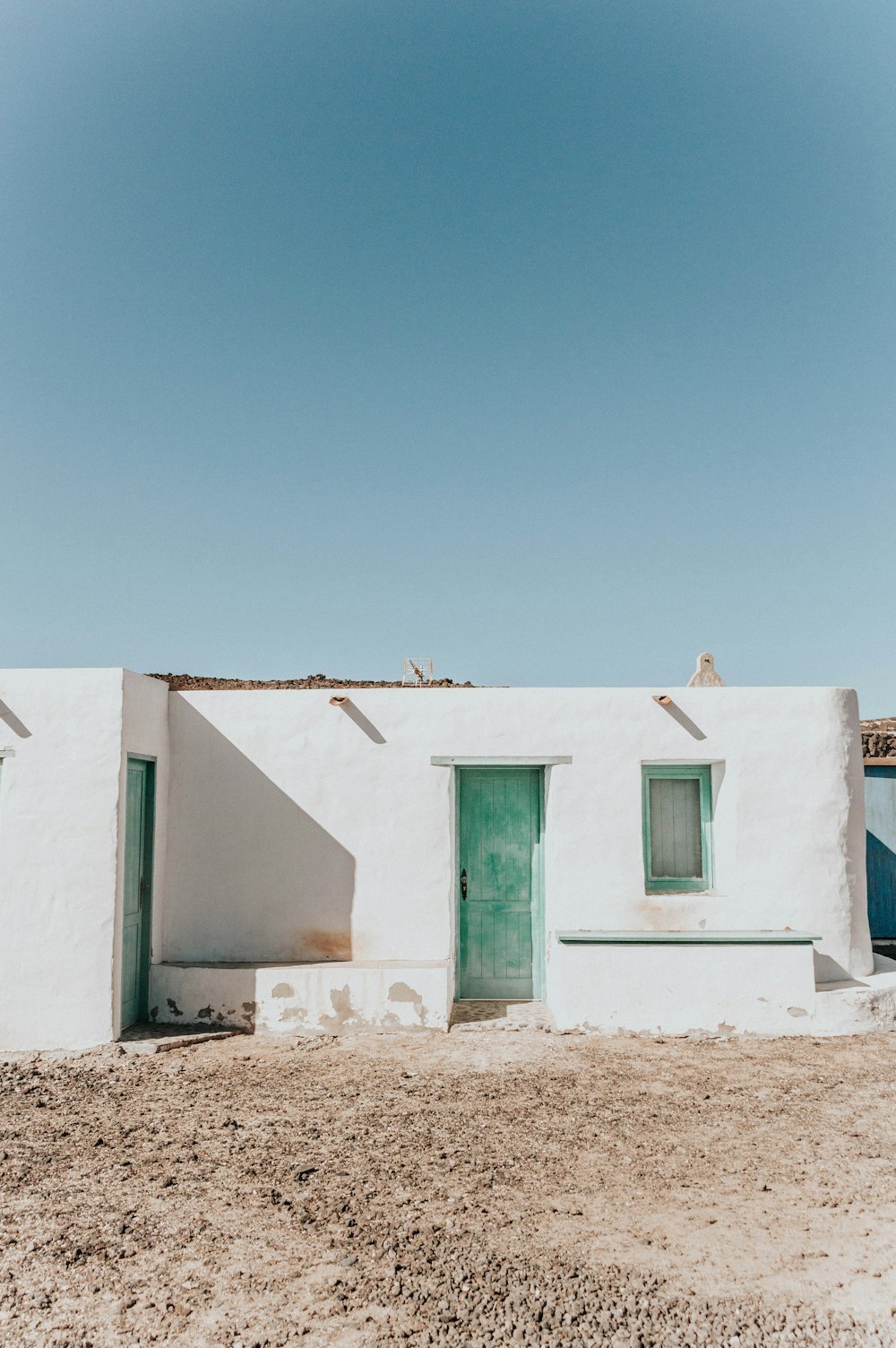 white concrete building under blue sky during daytime