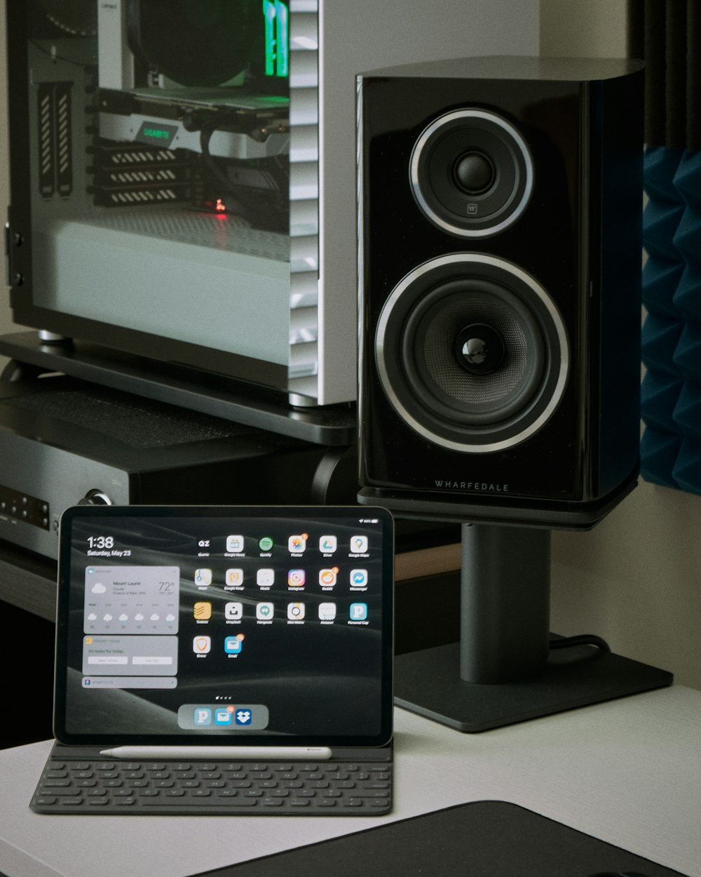 black and gray speaker beside black flat screen computer monitor