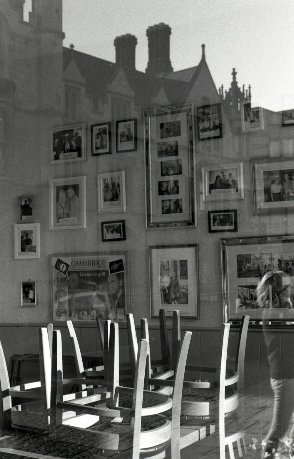 grayscale photo of man and woman on wall