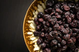 black berries on yellow ceramic plate