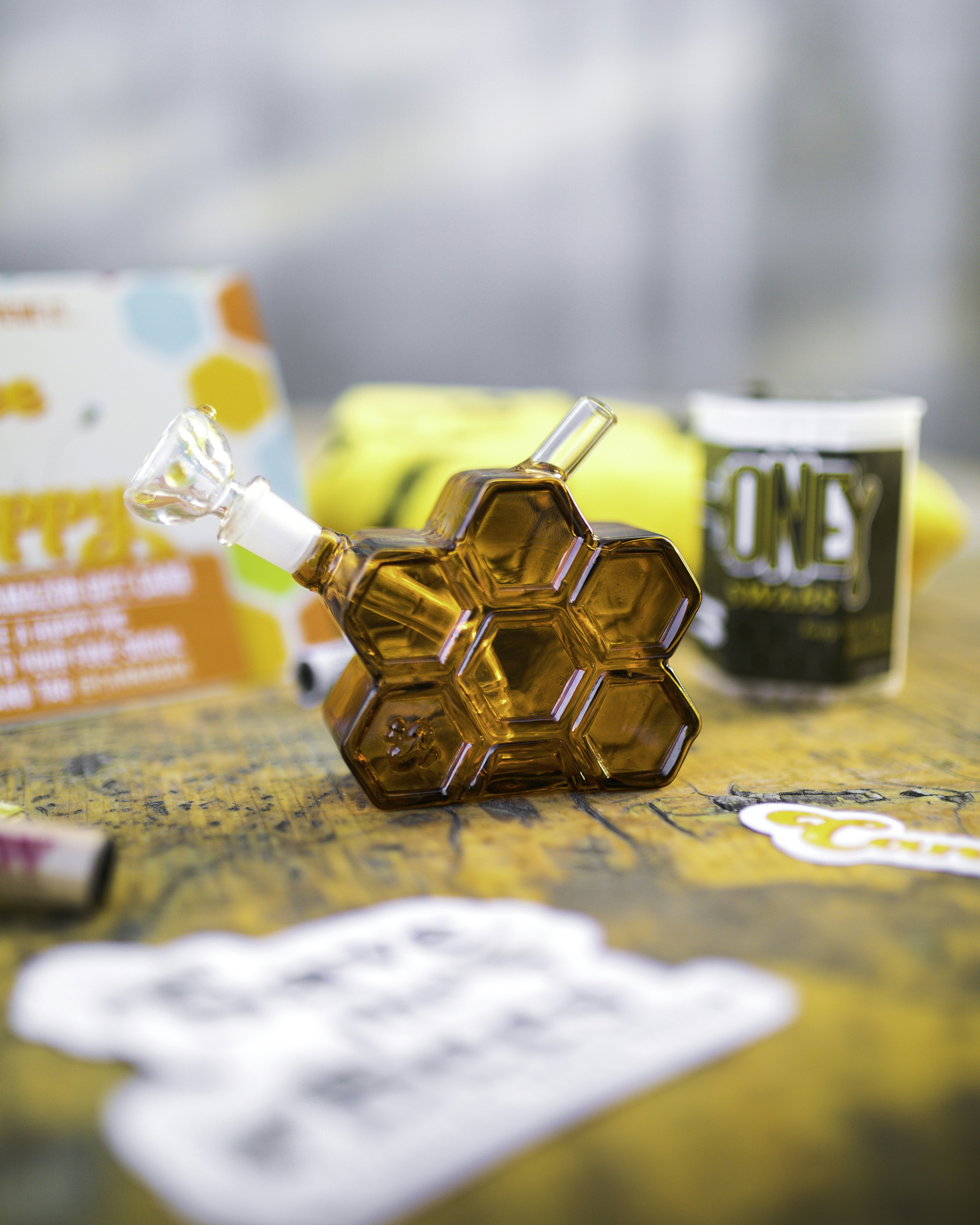 a table topped with a bottle of liquid and other items