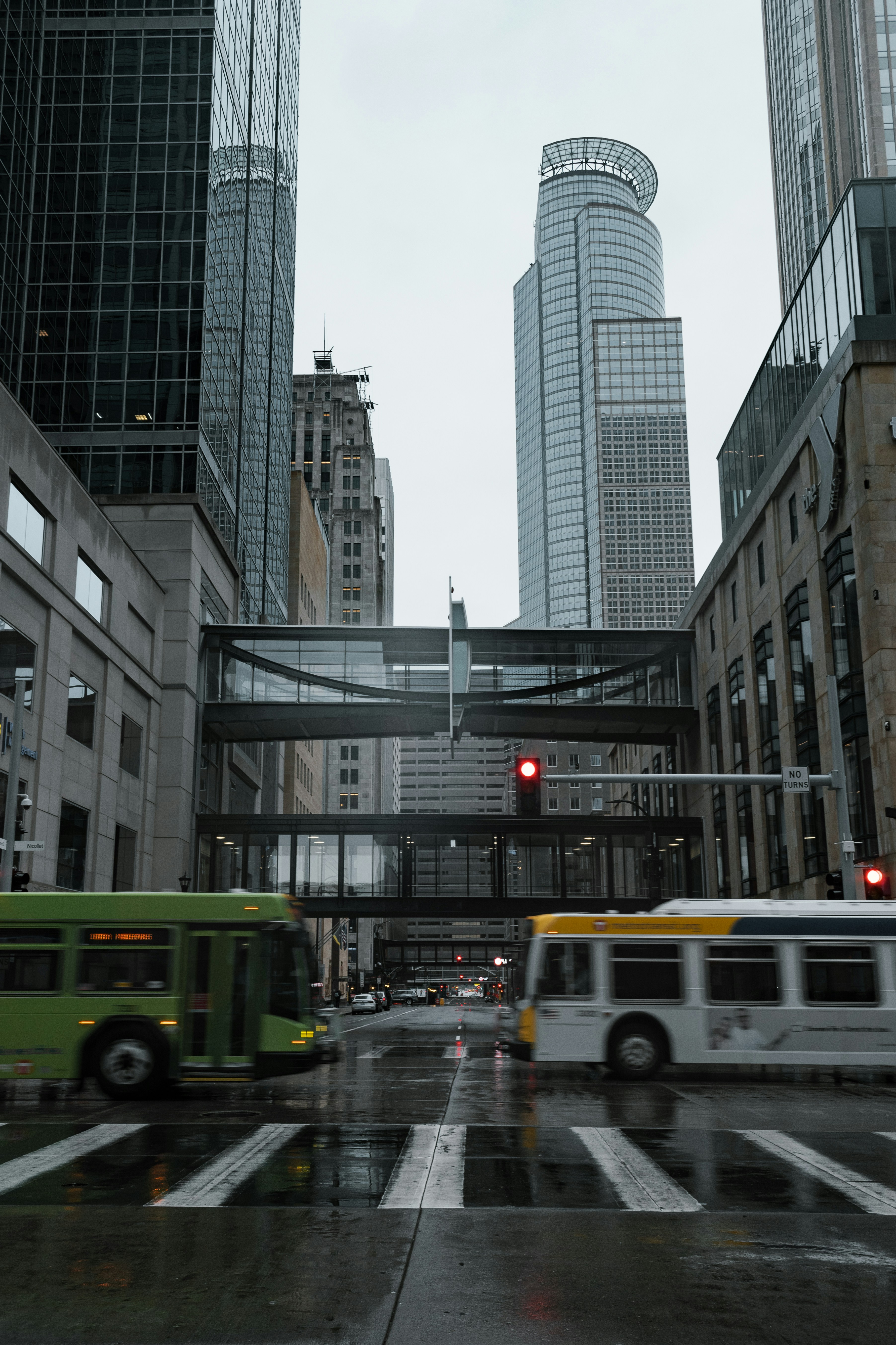 yellow and white bus on road near high rise buildings during daytime