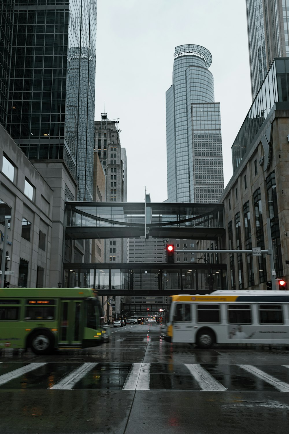 yellow and white bus on road near high rise buildings during daytime