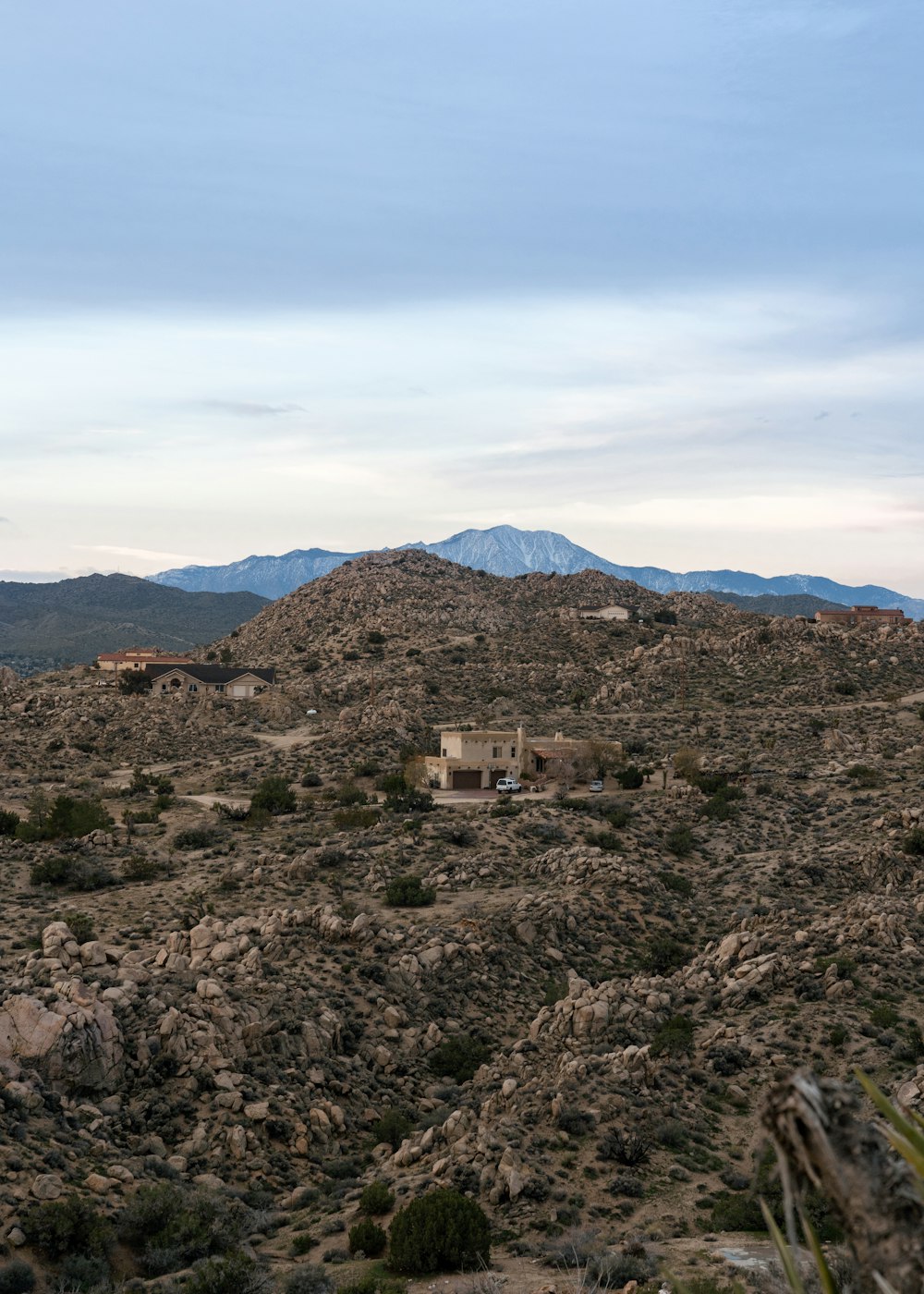 white and brown concrete house on top of mountain during daytime