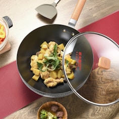 black frying pan with sliced vegetables