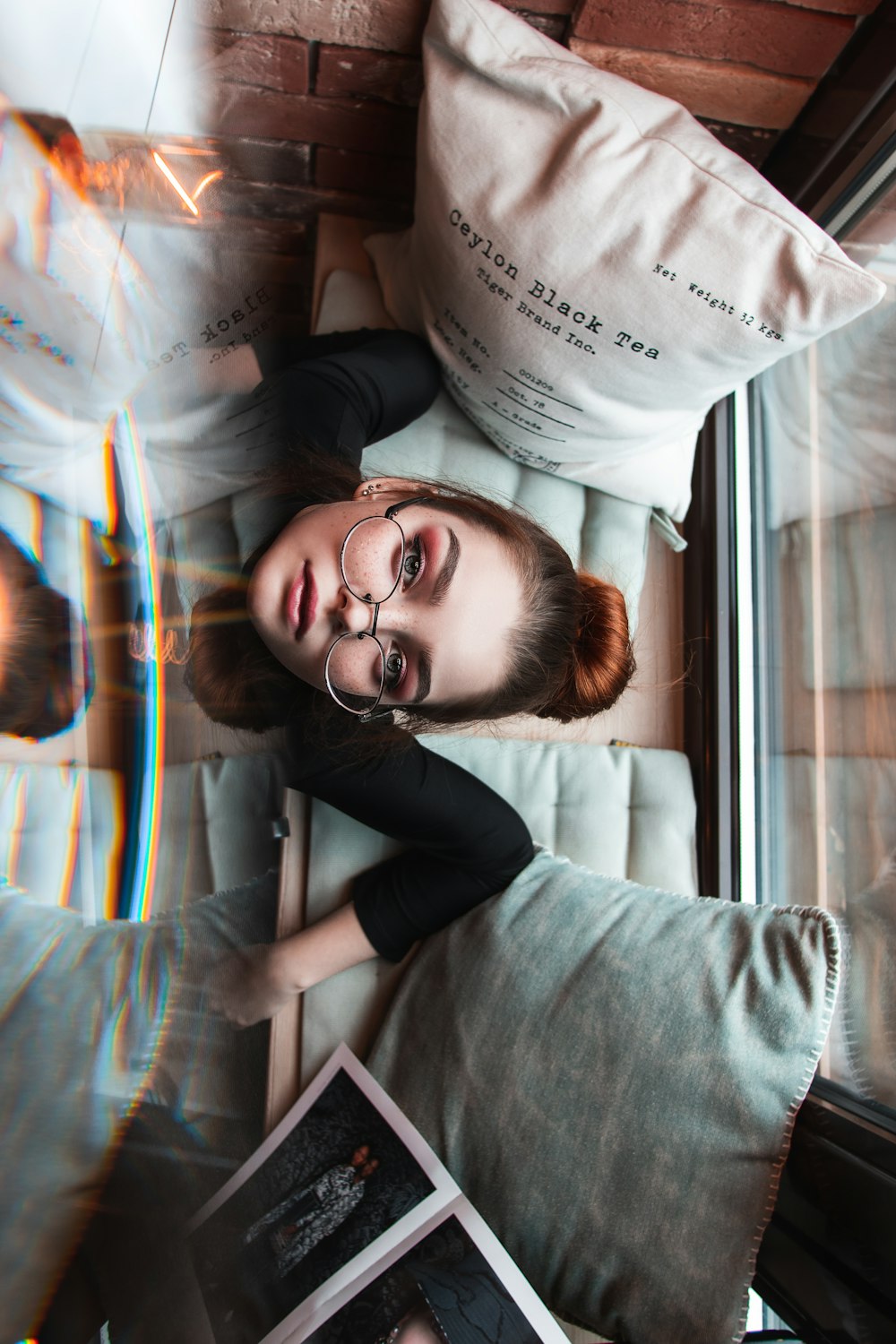 woman in gray long sleeve shirt wearing eyeglasses