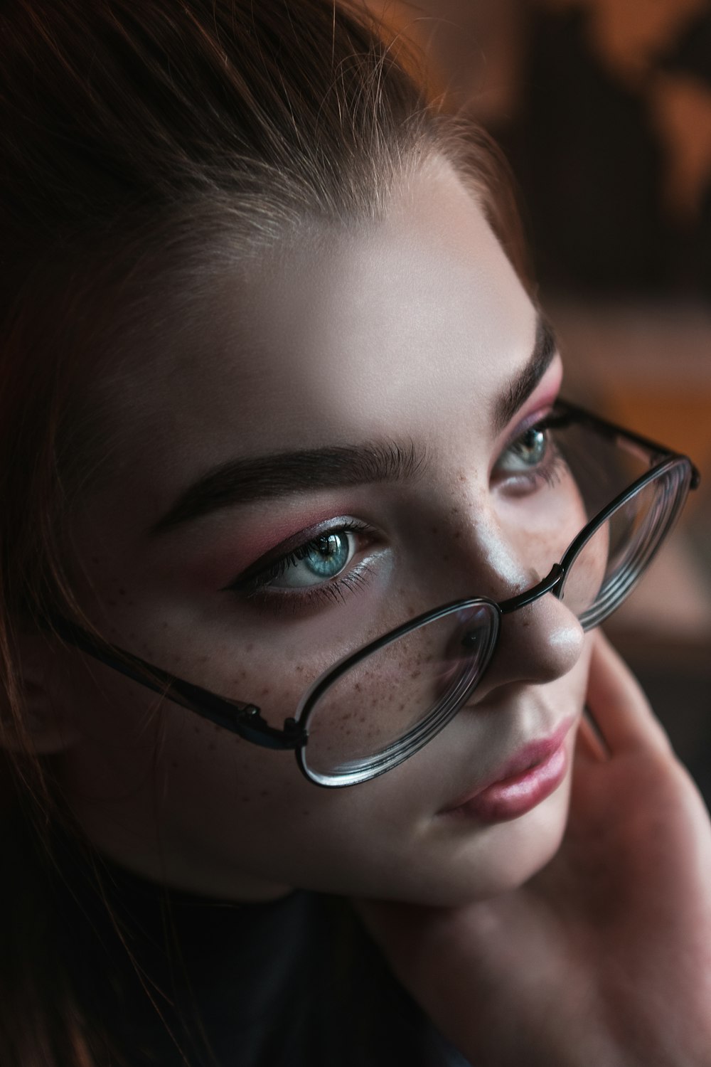 woman wearing black framed eyeglasses