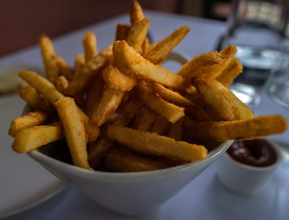 potato fries on white ceramic bowl
