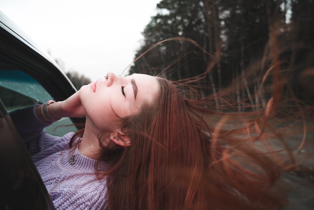 woman in blue and white striped shirt