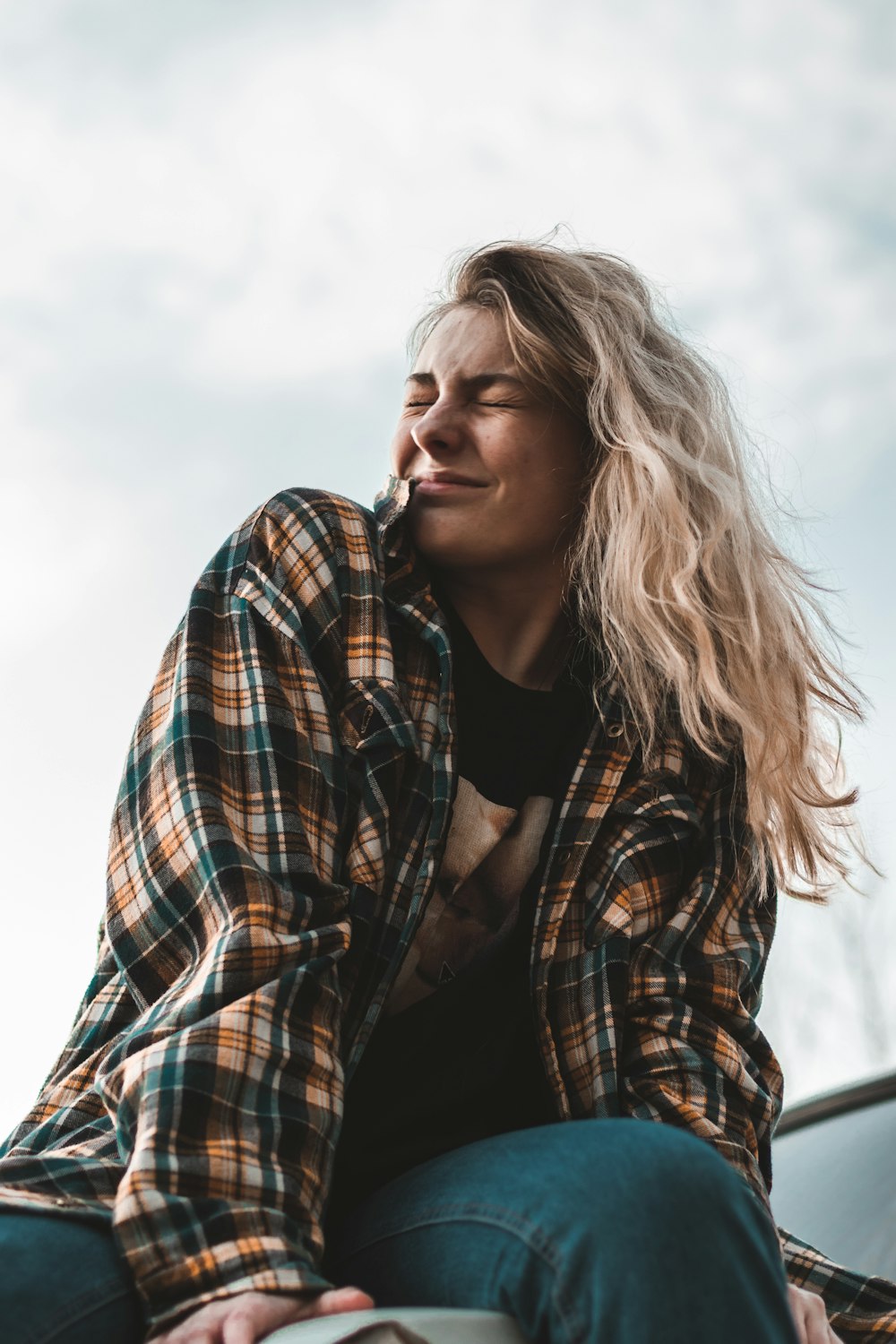 woman in black and white plaid long sleeve shirt