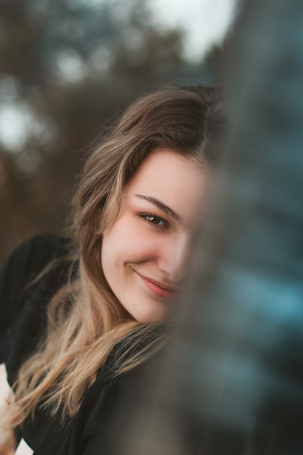 woman in black long sleeve shirt smiling